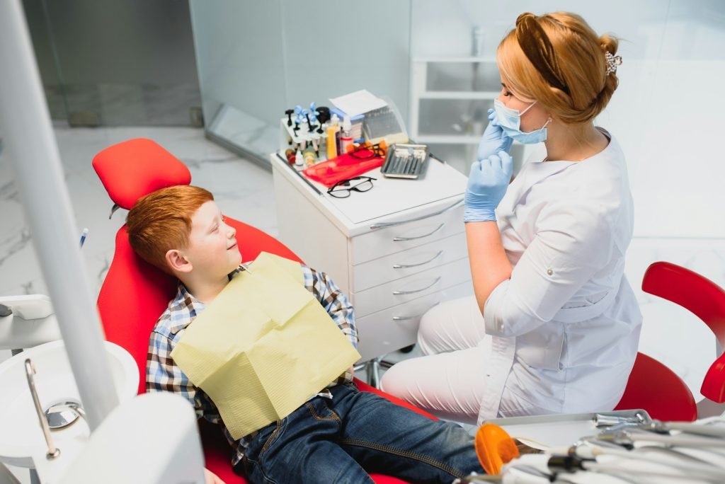 Female dentist and child in a dentist office